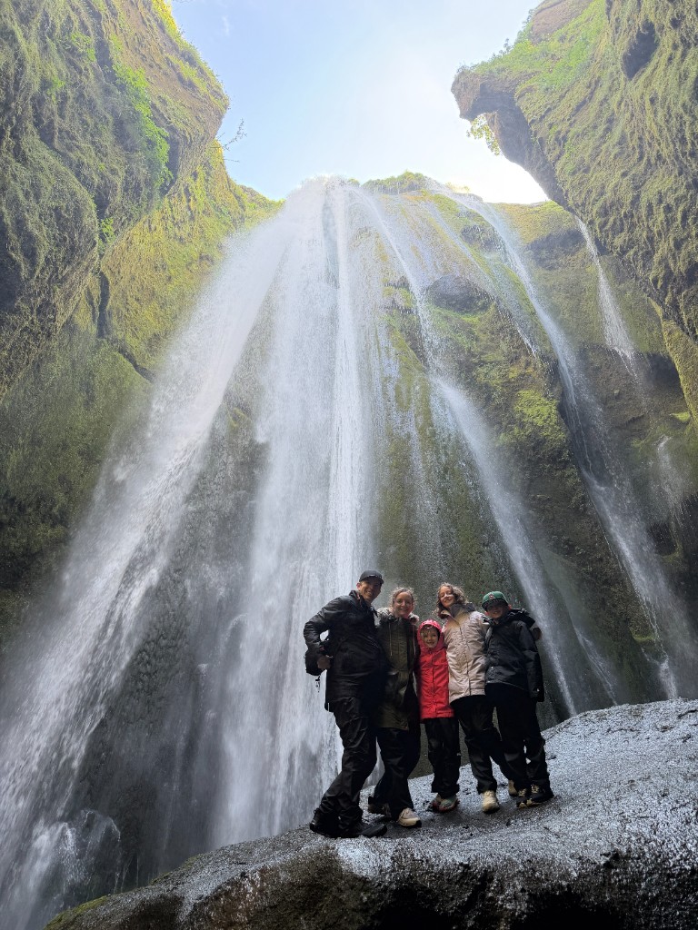 Family at Gljúfrabúi waterfall — Iceland, 2026