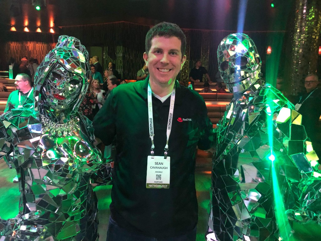 Working the Red Hat booth — Juniper NXTWORK, 2019